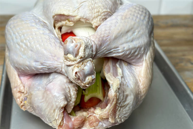 turkey with trussed legs on silver tray