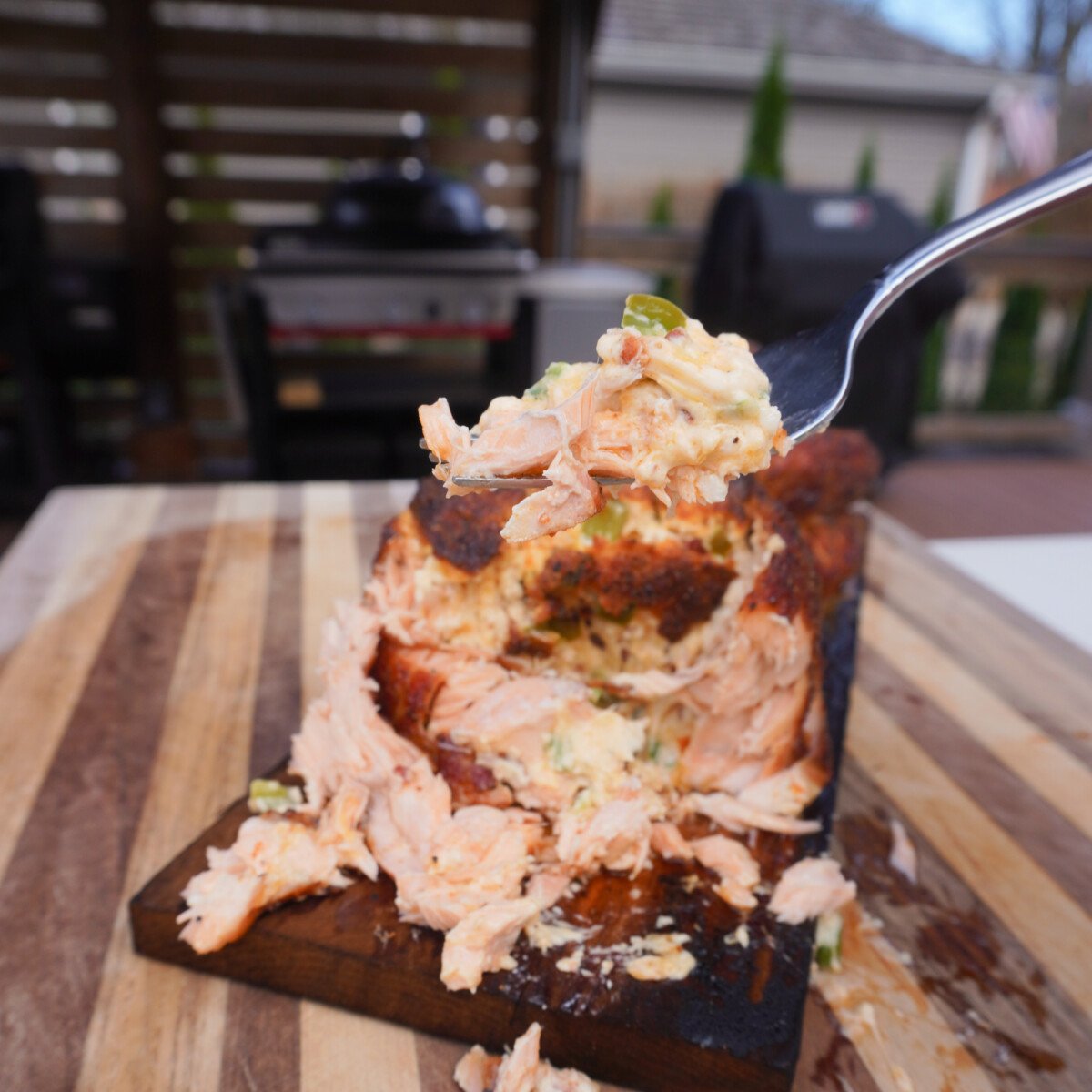 a fork full of the grilled jalapeno popper salmon.