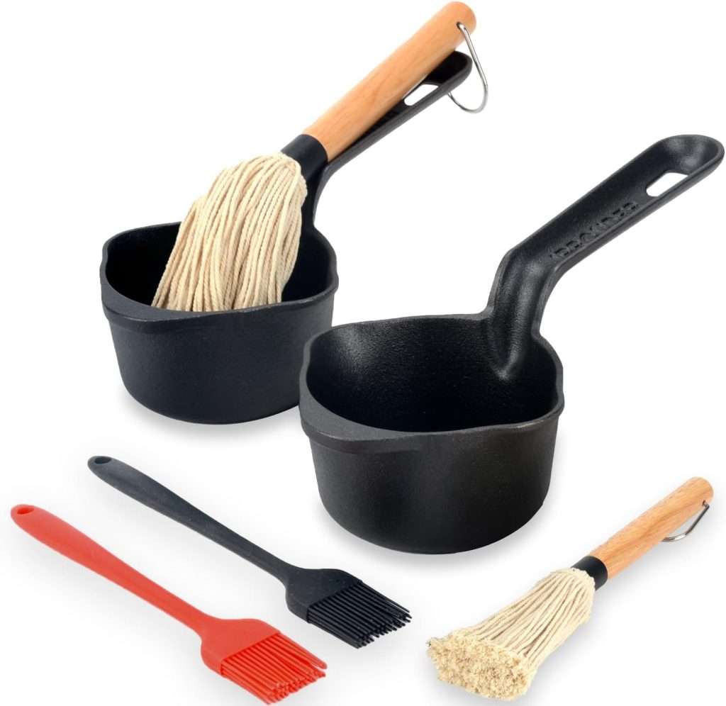 cast iiron pot with mops and brushes for basting
