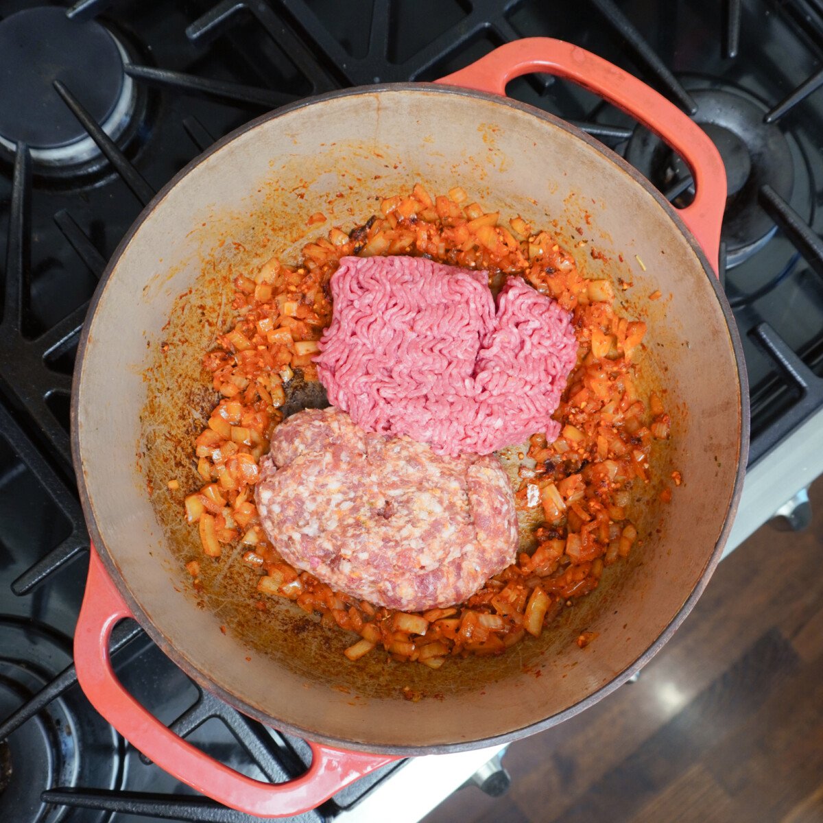 Beef and Italian sausage in dutch oven.