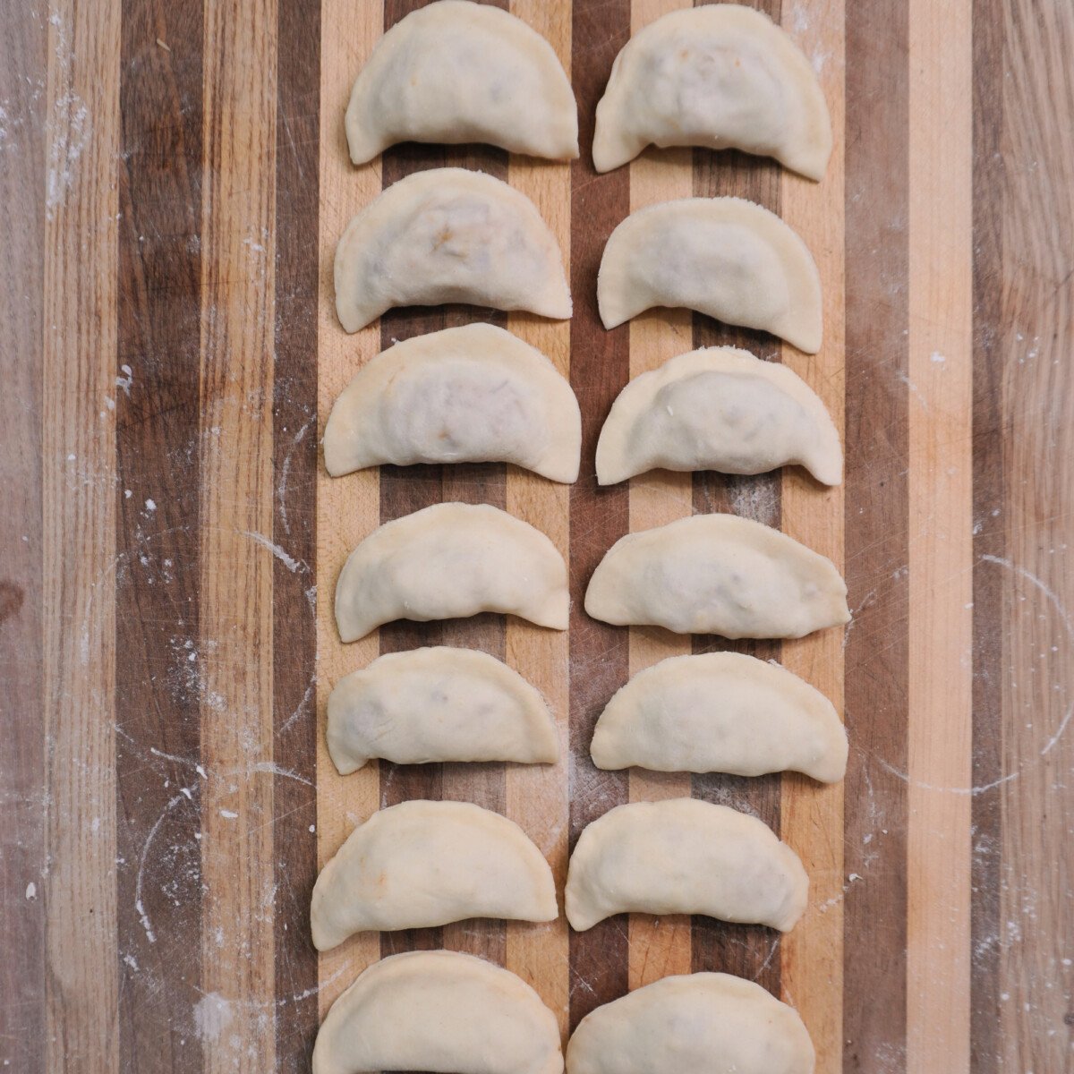 Filled raw pulled pork pierogi.