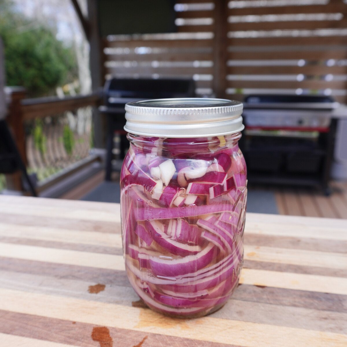 pickled red onion in a mason jar.