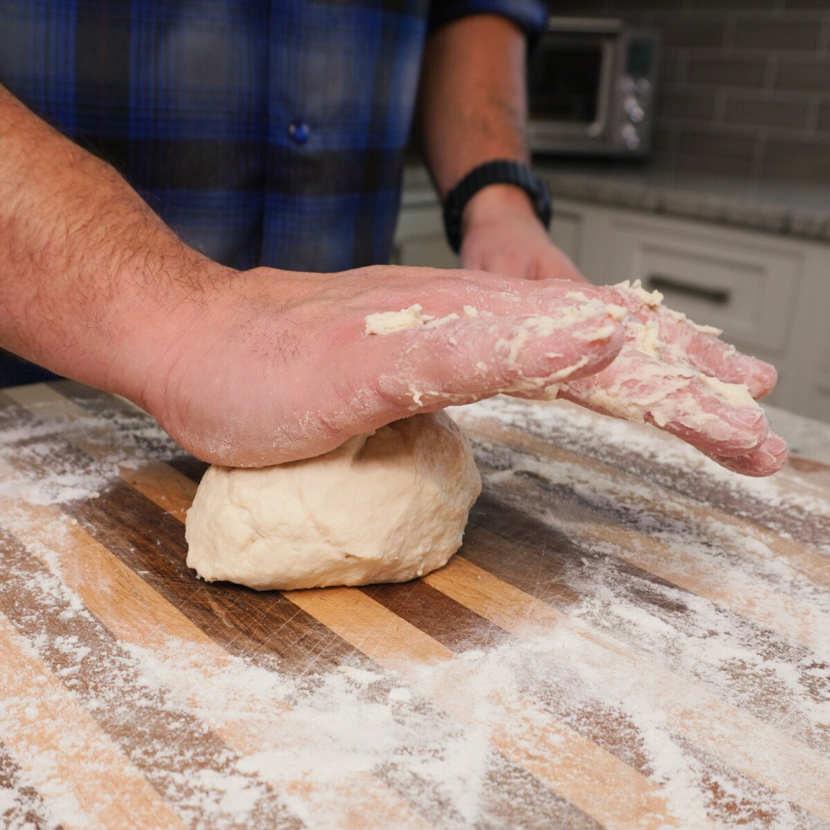 Kneading dough for pierogi.