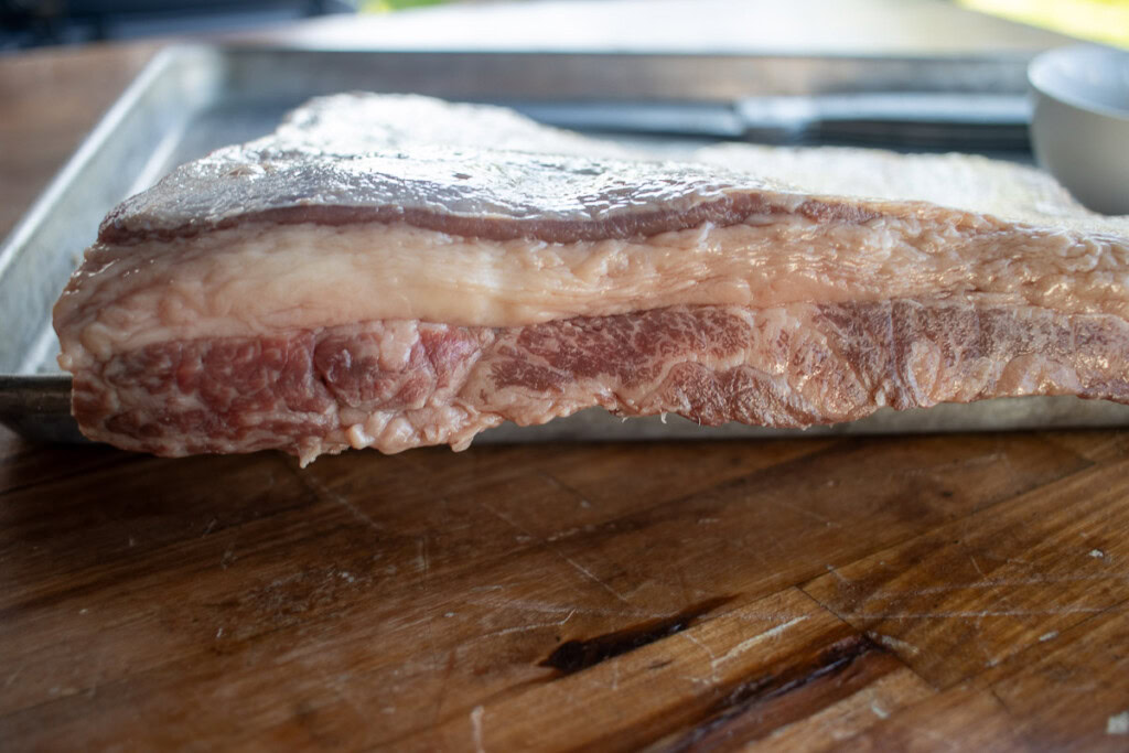 a raw side on piece of beef belly