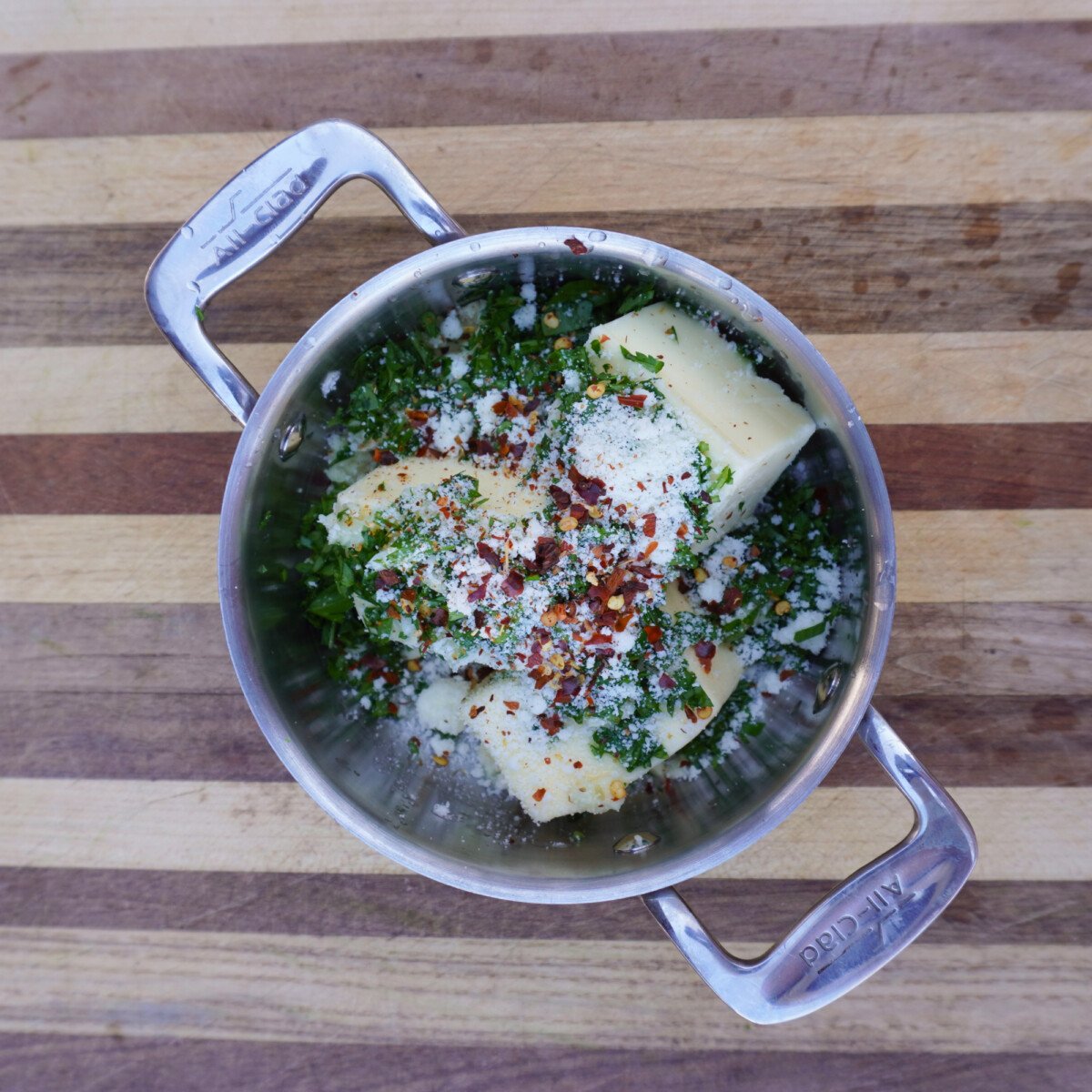 garlic and herb butter ingredients in a saucepan.