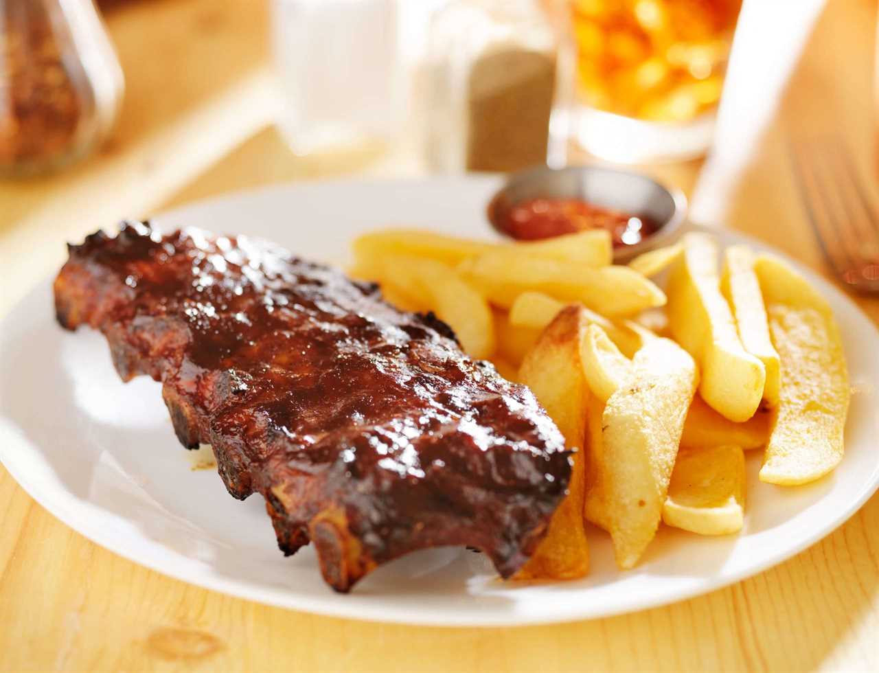 Memphis BBQ Sauce on ribs on a plate with french fries