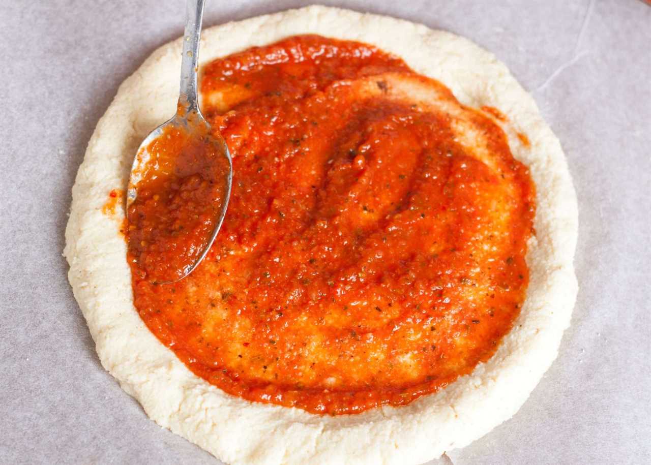 Gluten-Free Pizza Dough with tomato sauce.