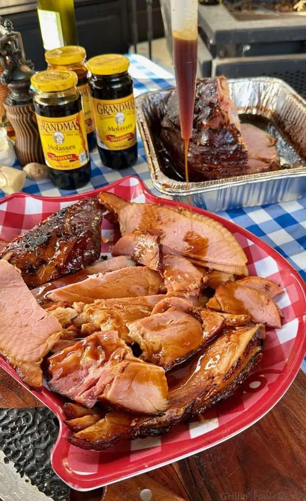 Drizzling the Rum Glaze over the Smoked Ham