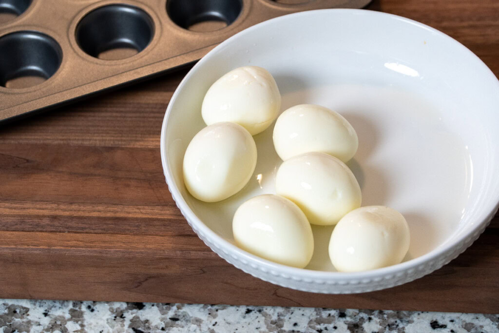 peeled boile eggs in a white bowl
