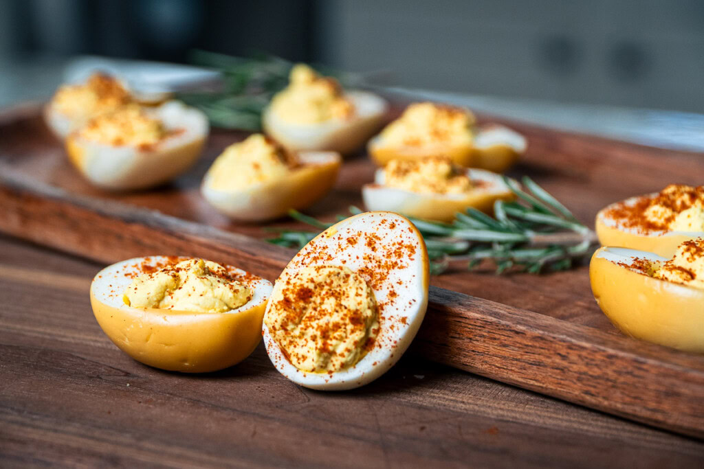 smoked deviled eggs ready to serve with a sprinkle of paprika