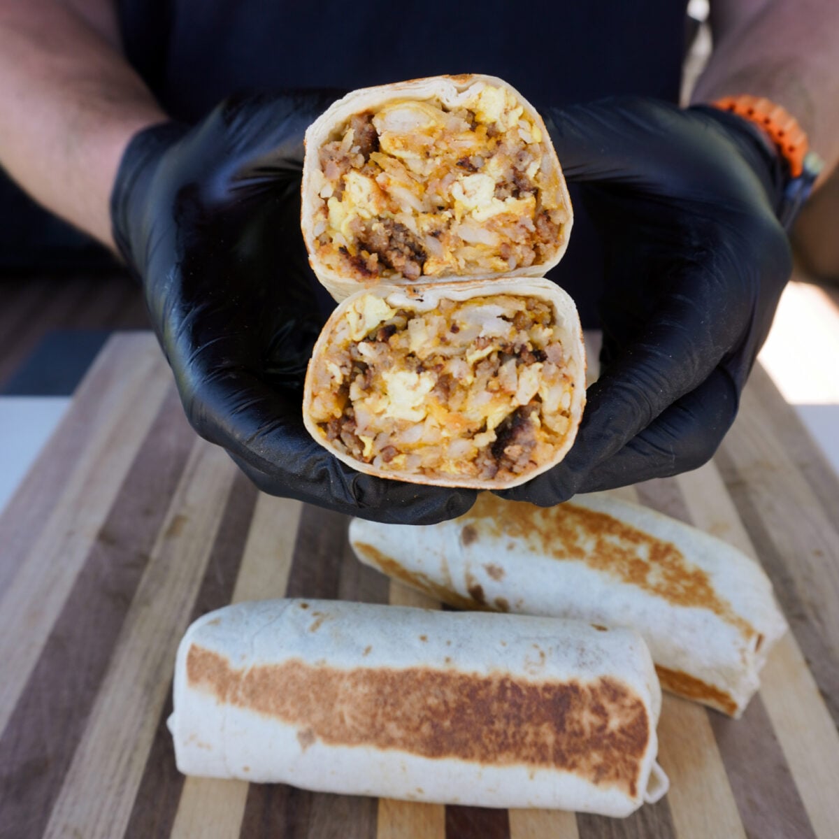 The ultimate breakfast burrito held.