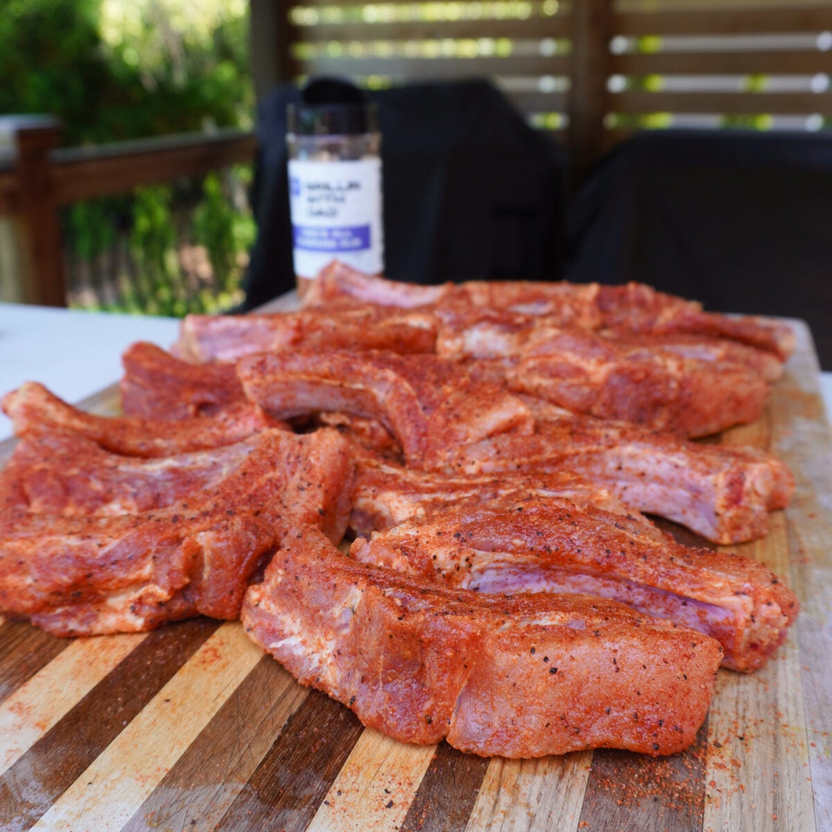 Seasoned raw party ribs.