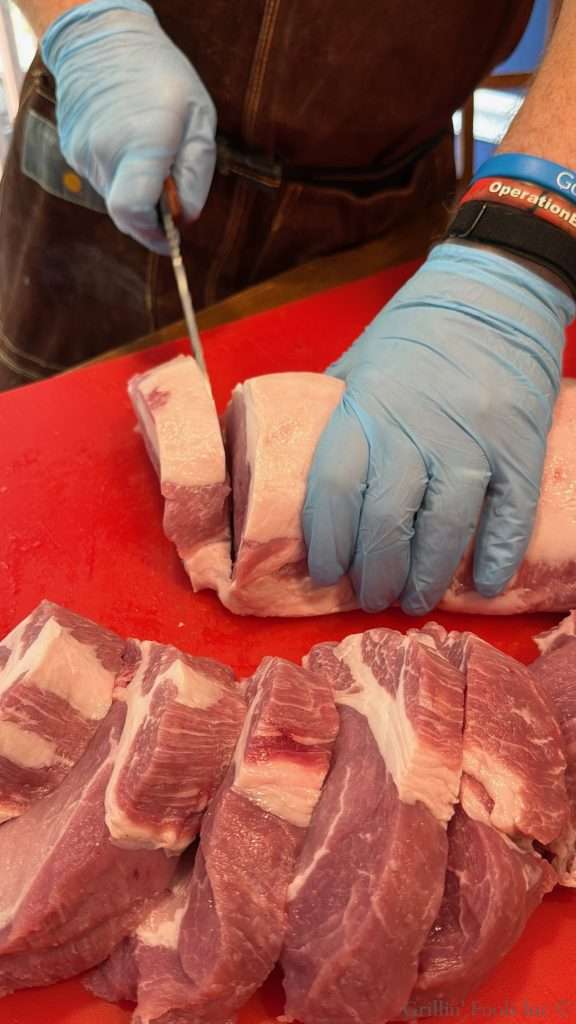 Carving pork chops off a whole pork loin
