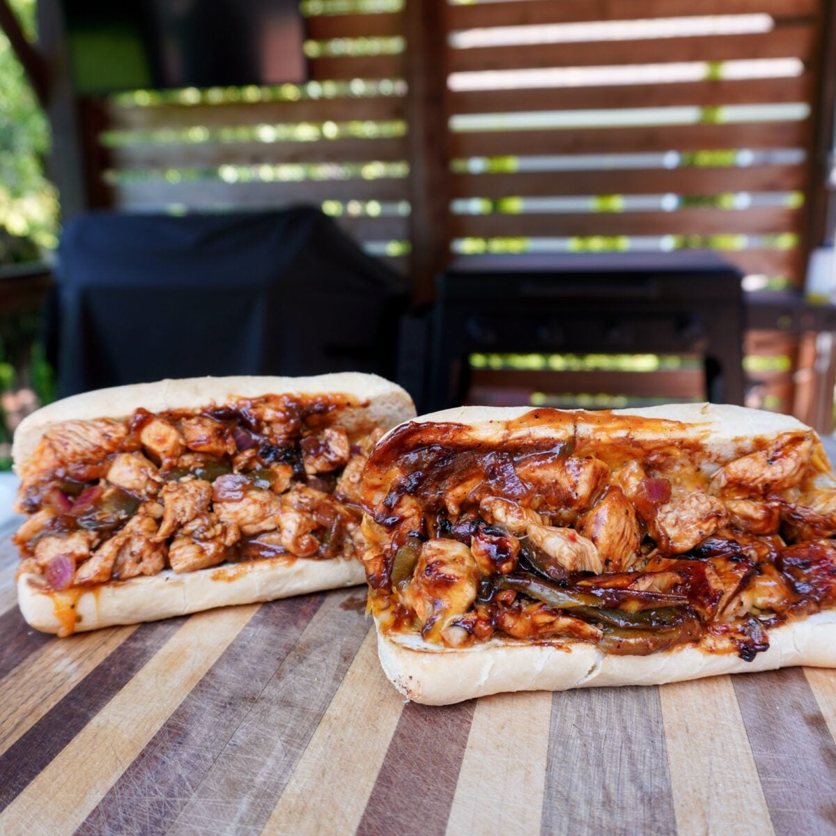 Chopped Spicy Chicken Sandwhich on wooden cutting board.