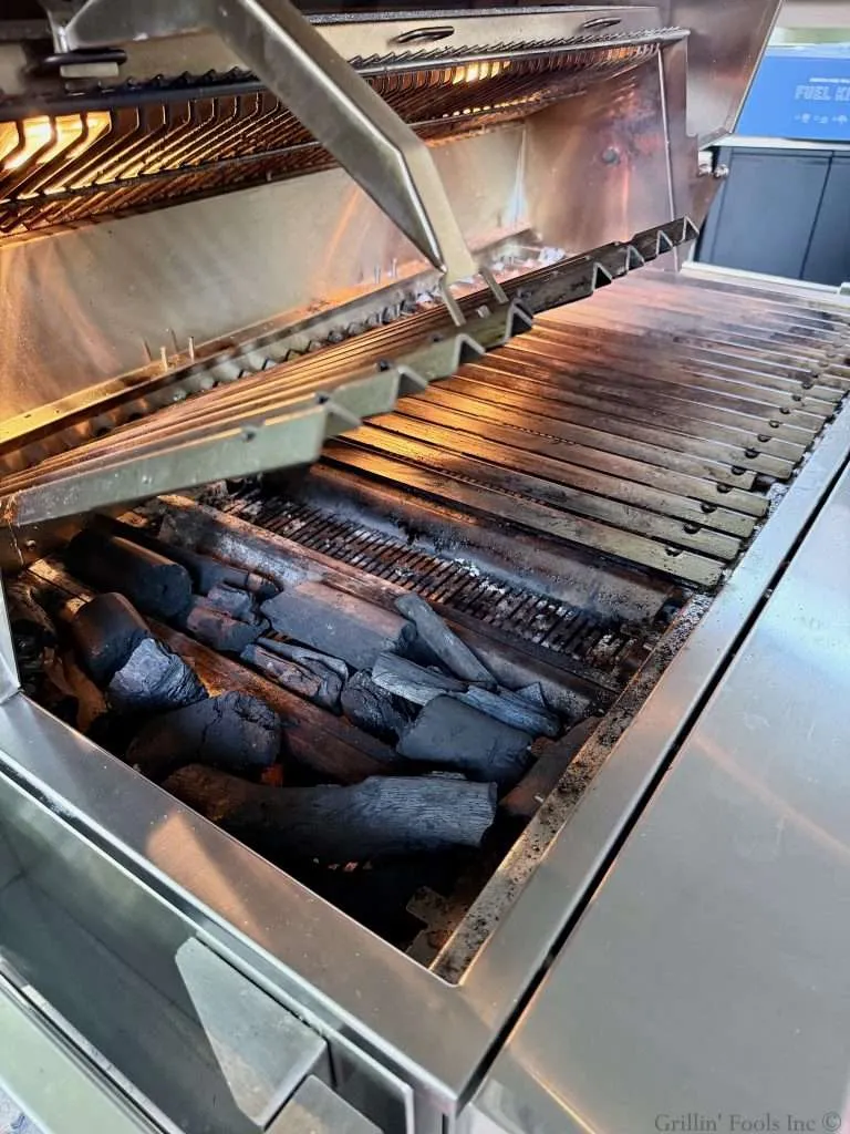 Coals on one side of the grill with no direct heat on the other for indirect grilling