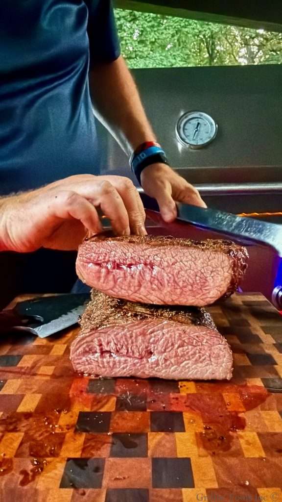 A sliced tri tip, sitting medium rare