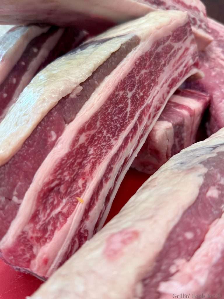 A close up of the amazing marbling on these beef plate ribs