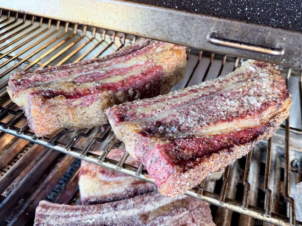 Two beef ribs after about 45 minutes on the grill