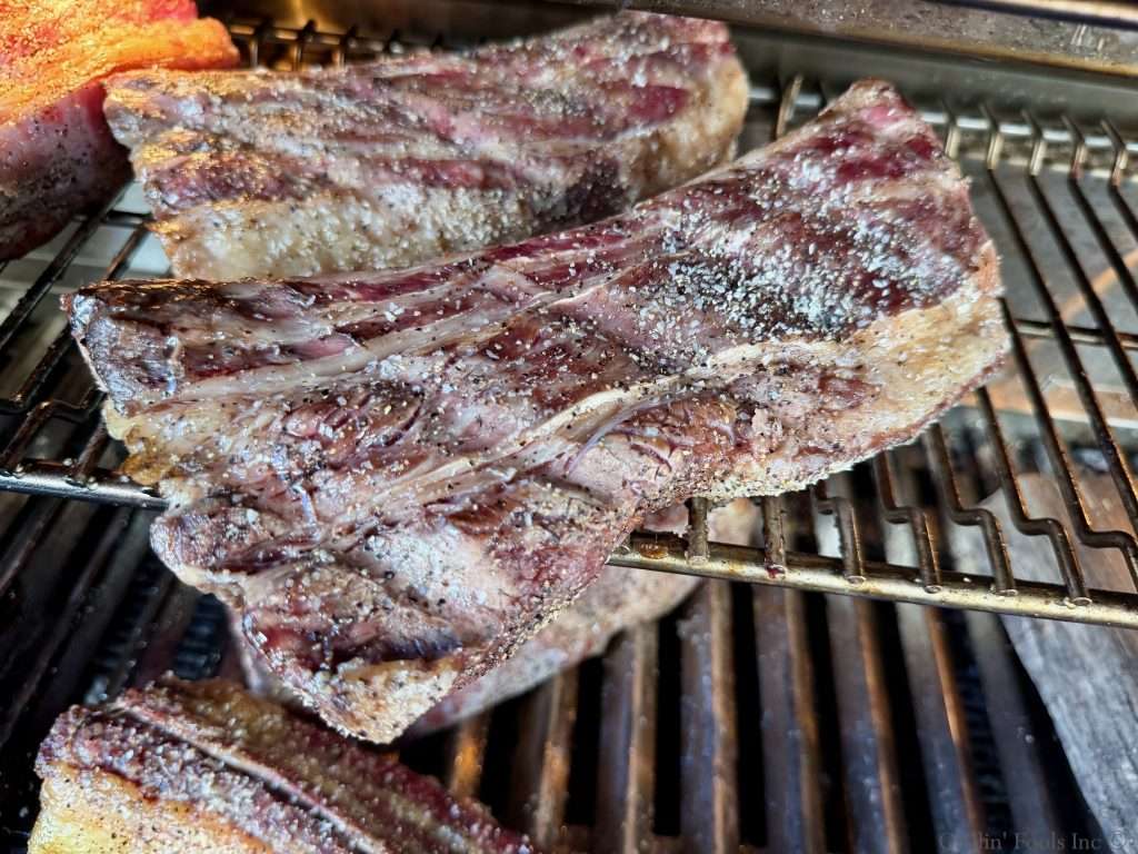 Two beef ribs after about 45 minutes on the grill