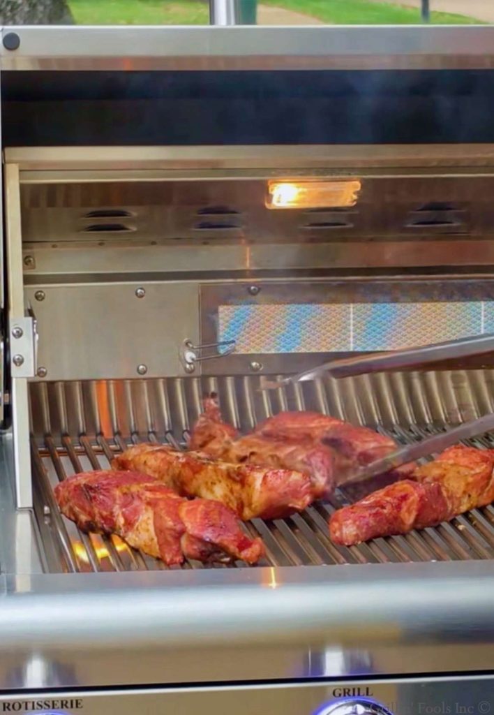 A quick flare up of some pork country style ribs on a stainless steel grill