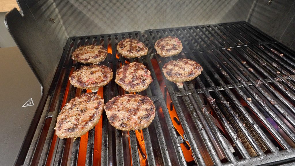Burgers searing on the flat side of the Weber Genesis grates